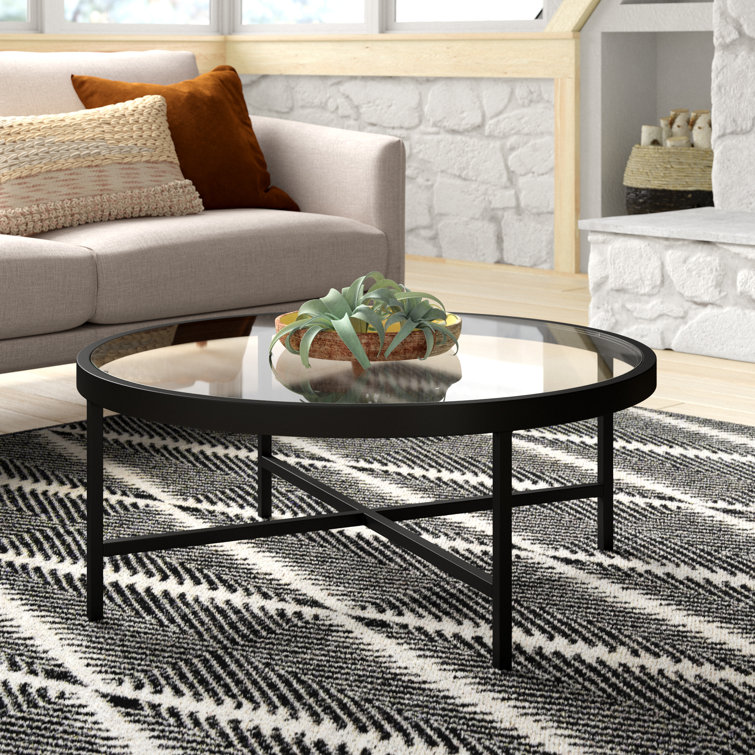 Round glass coffee table deals black legs